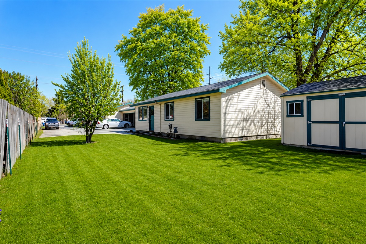 Apt. 1: View of home from corner of large partially fenced front/side yard.