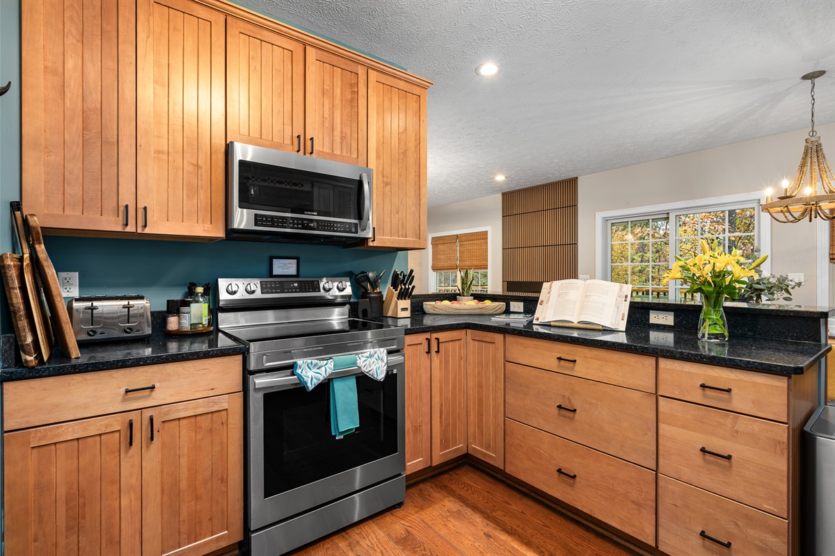 Cook with ease in a fully equipped kitchen featuring stainless steel appliances, plenty of counter space, and everything you need to whip up family feasts.