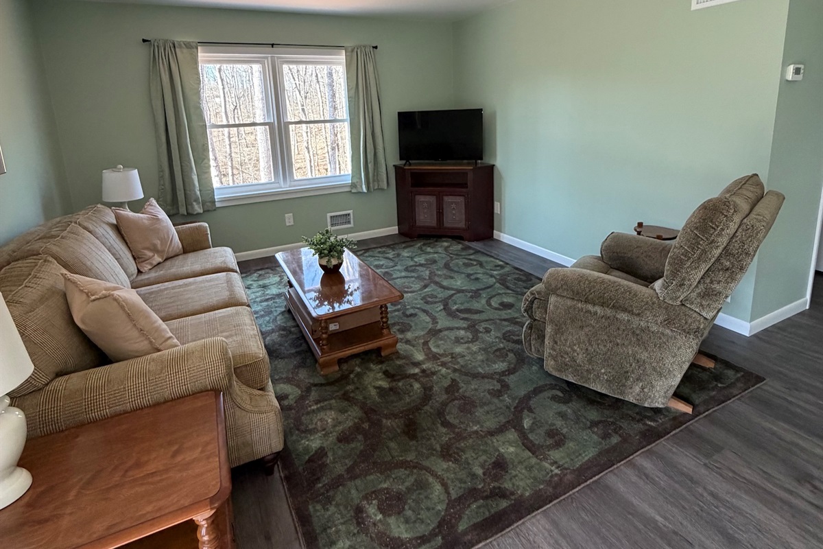 Spacious living area with smart tv