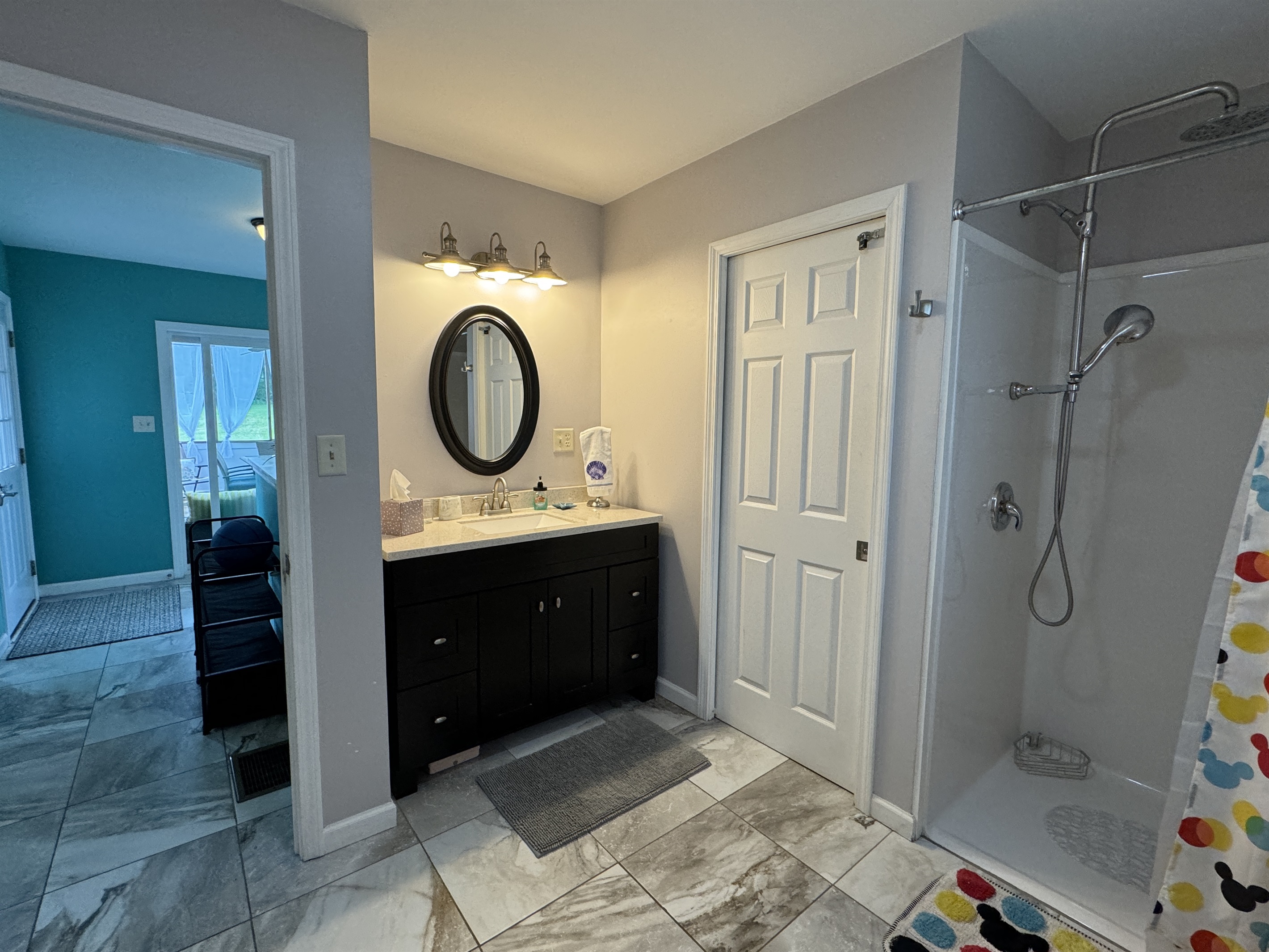 1st Floor full bathroom with wide shower.