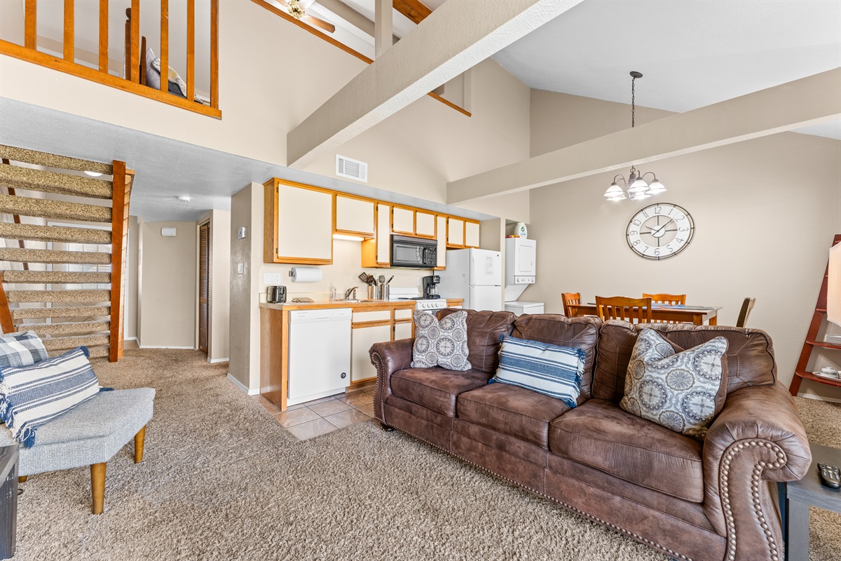 Open-concept living, dining, and lofted ceilings create a roomy, relaxed feel.