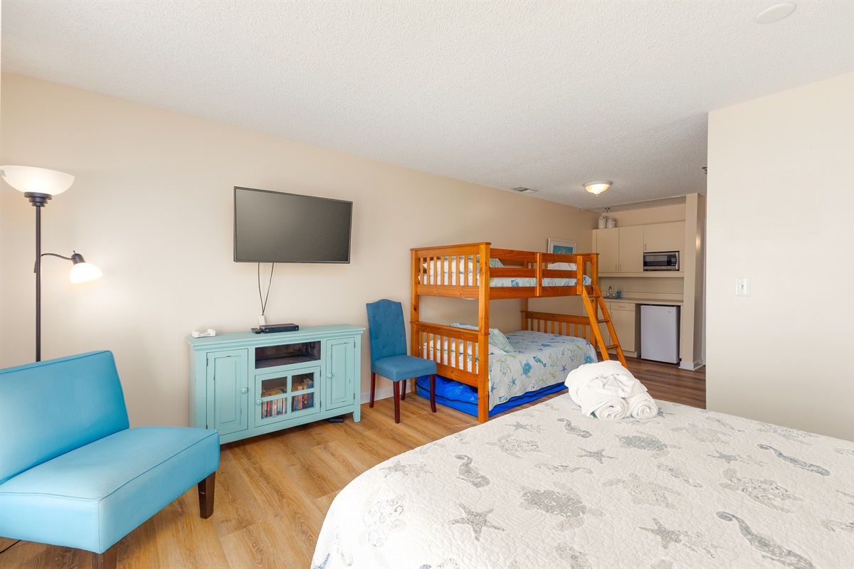 Enjoy movie nights or unwind in bedroom 3, equipped with Smart TV, kitchenette and ample seating