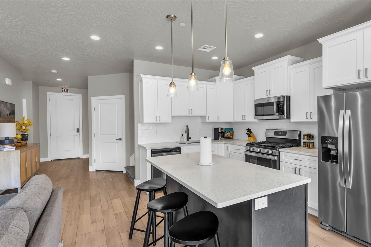 Quartz-Top Island with Pendant Lighting & Breakfast Stools