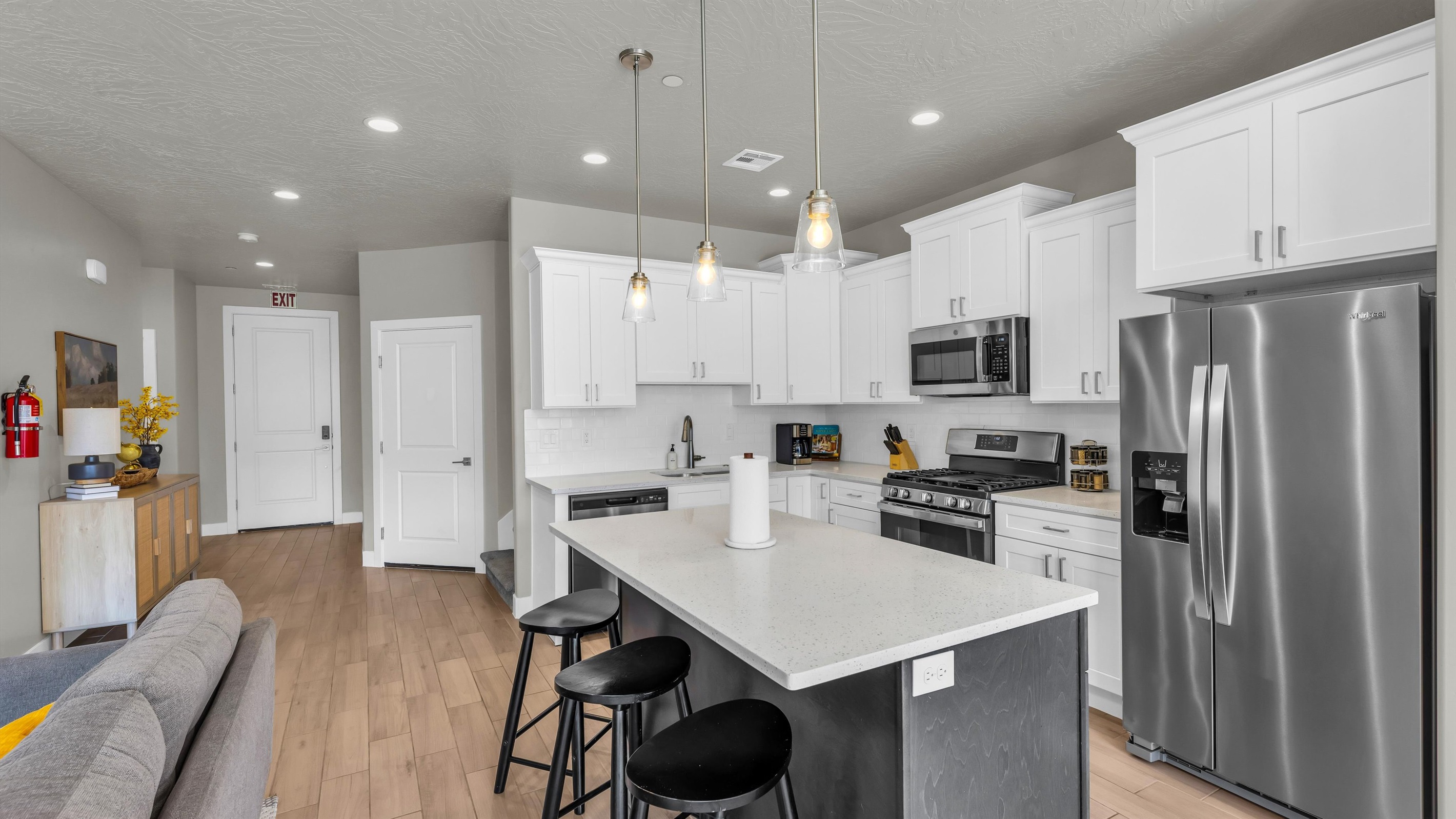 Quartz-Top Island with Pendant Lighting & Breakfast Stools