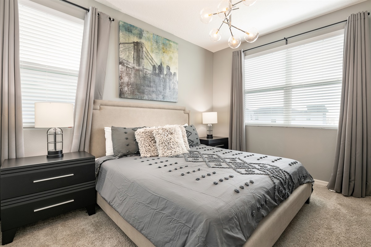 Bedroom 4 has a king bed & beautifully w/ slate gray accents. Shared bathroom with B3.