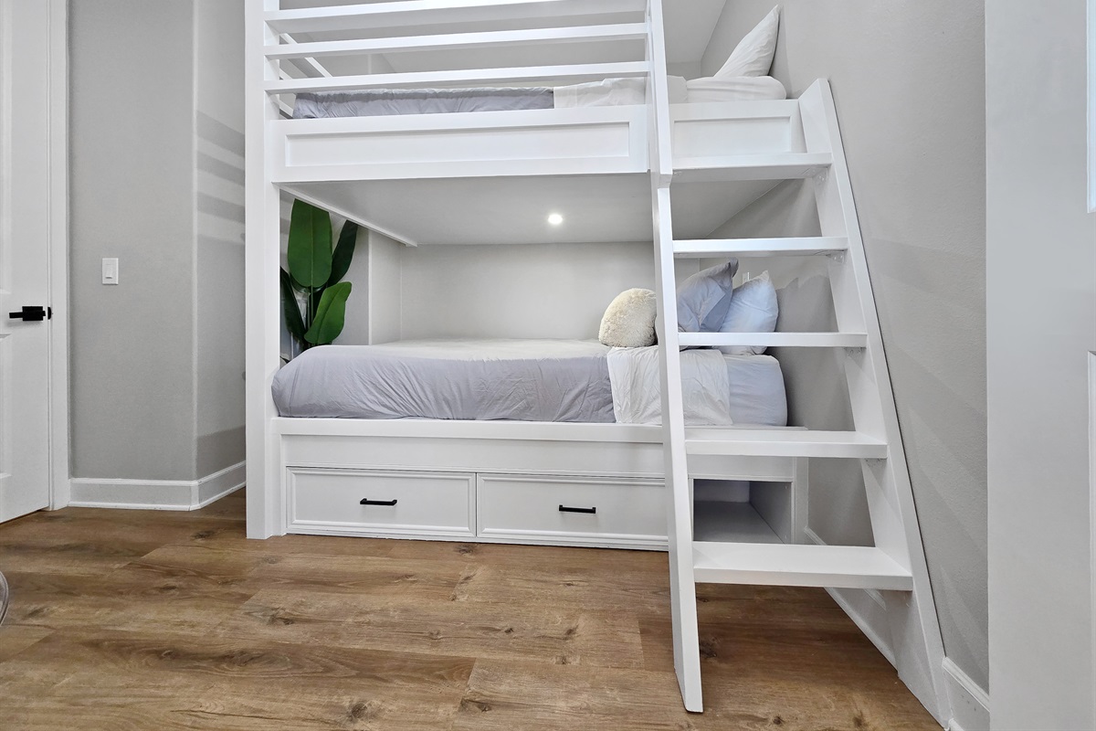 Bedroom #5 is next to the upstairs primary bathroom/bedroom and features an adult bunkbed, queen over queen (Sleeps up to 4).