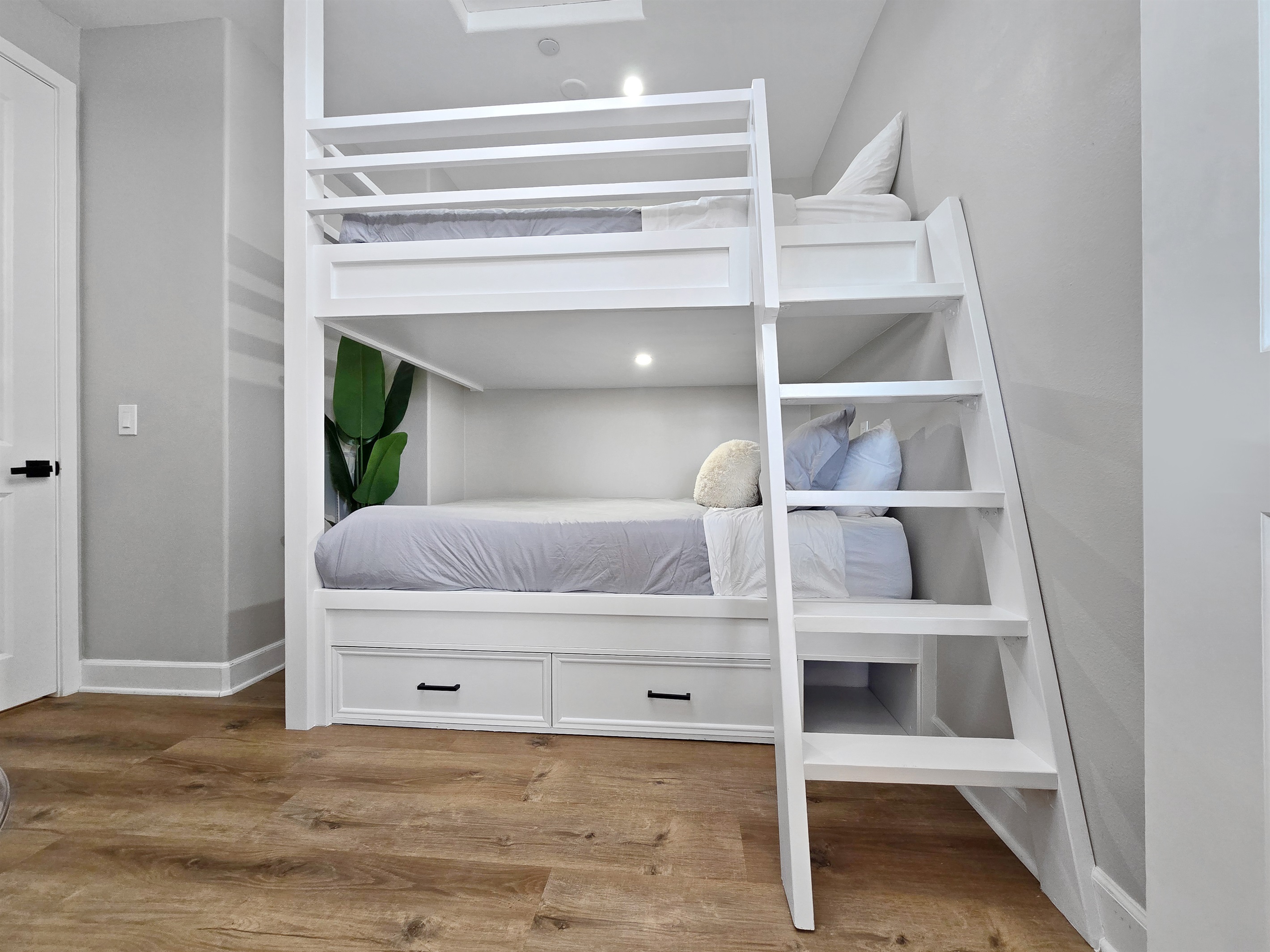 Bedroom #5 is next to the upstairs primary bathroom/bedroom and features an adult bunkbed, queen over queen (Sleeps up to 4).