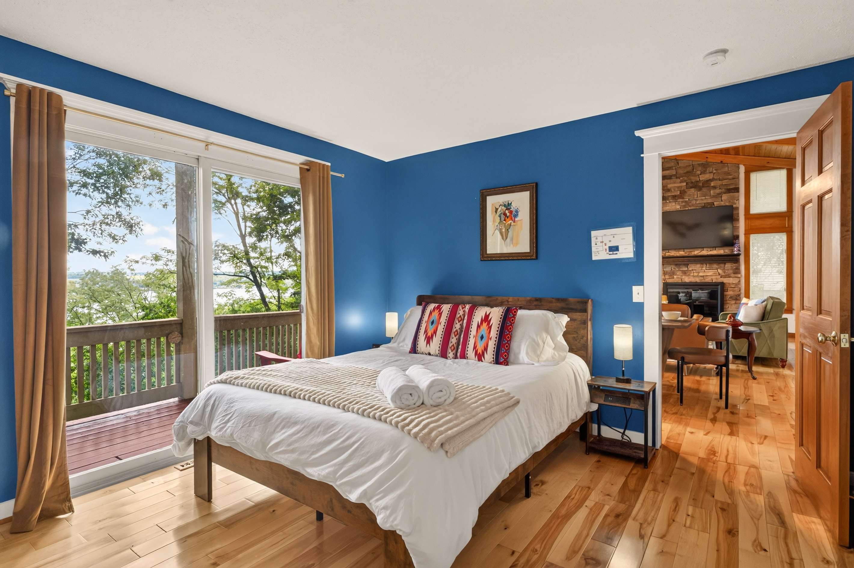 Blue bedroom with wooded views