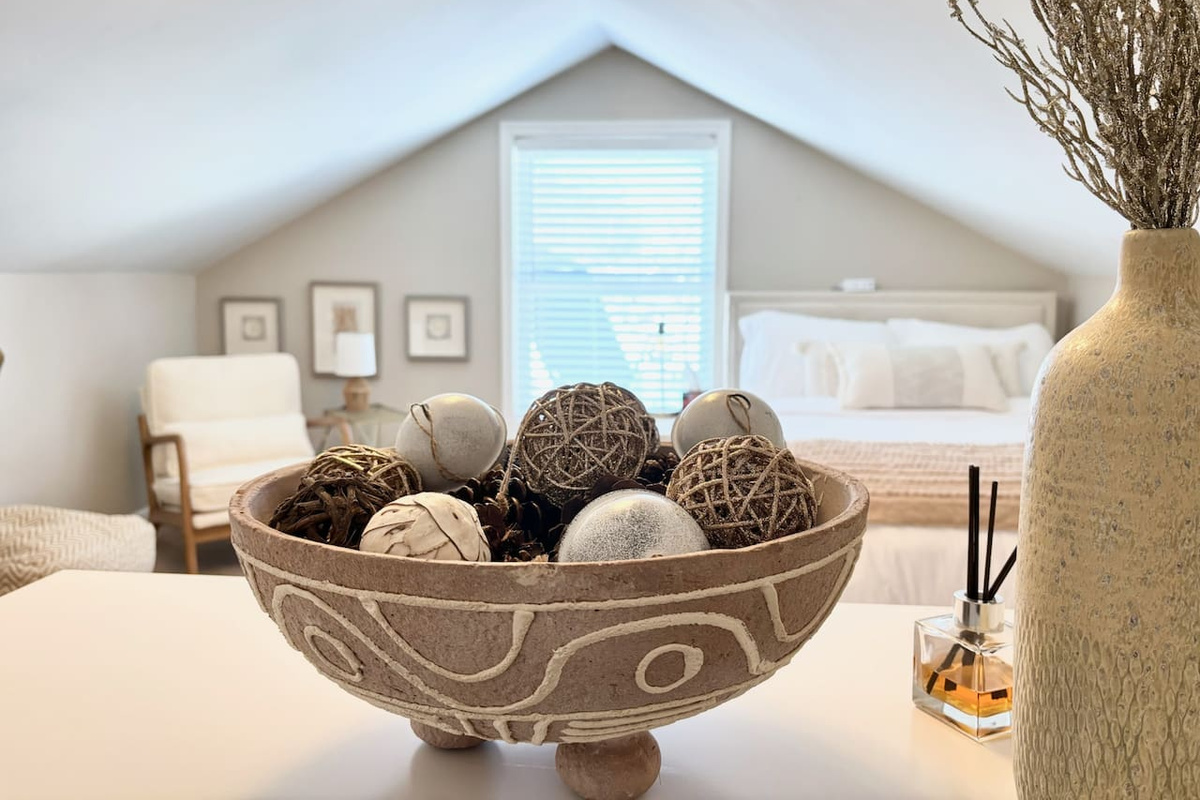 Comfortable bedding and thoughtful details in the main-floor bedroom.