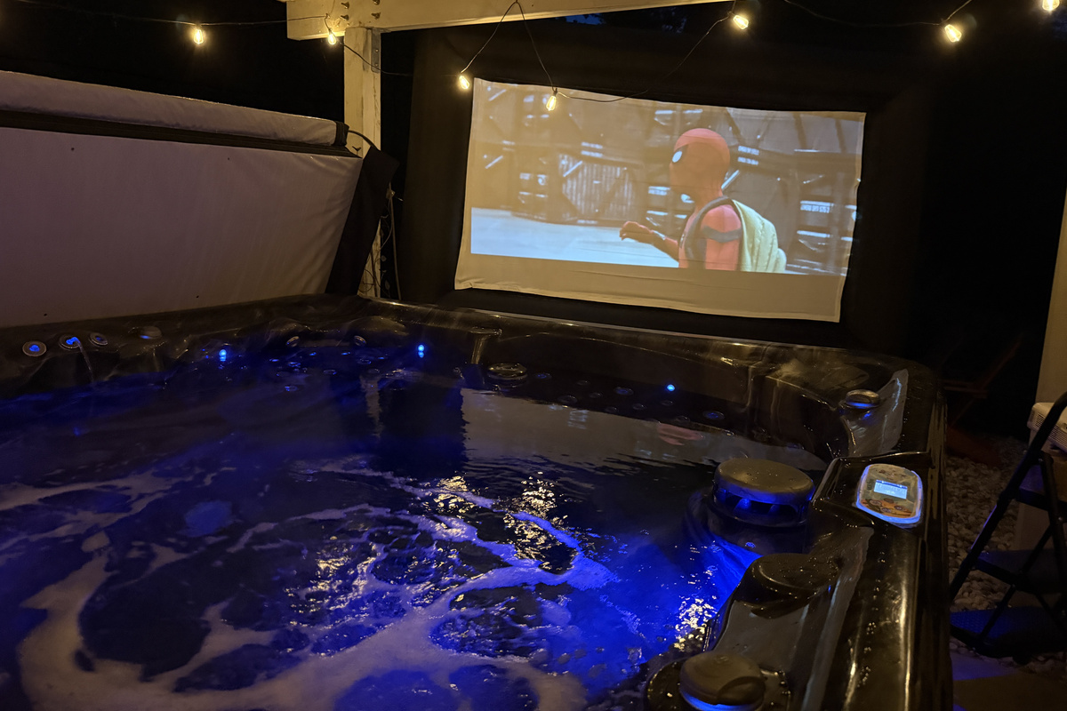 Watch a movie on our inflatable screen at night from the hot tub or next to the fire :)