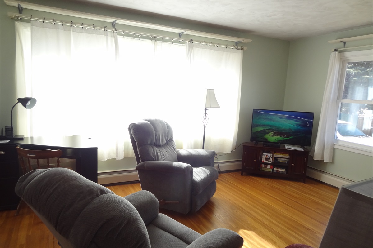 Full size couch, 2 recliners, Roku smart TV, laptop work space