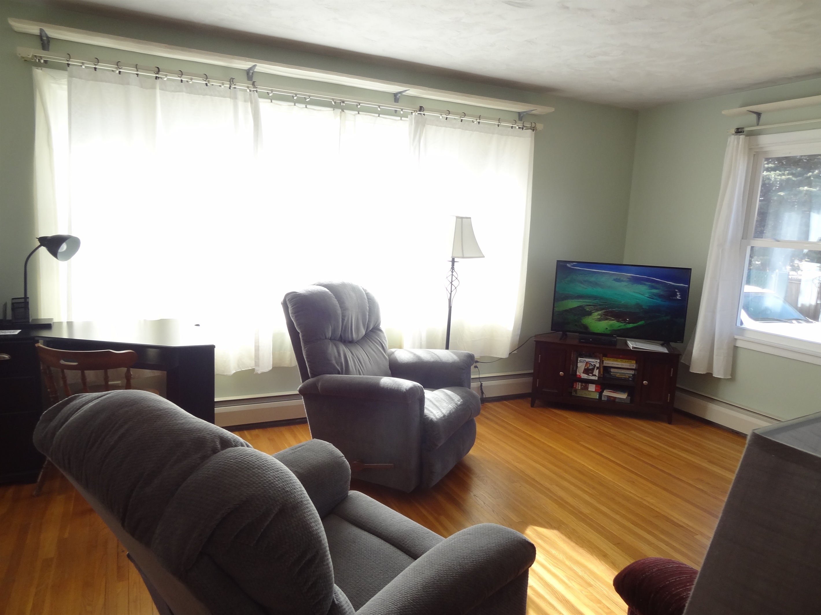 Full size couch, 2 recliners, Roku smart TV, laptop work space