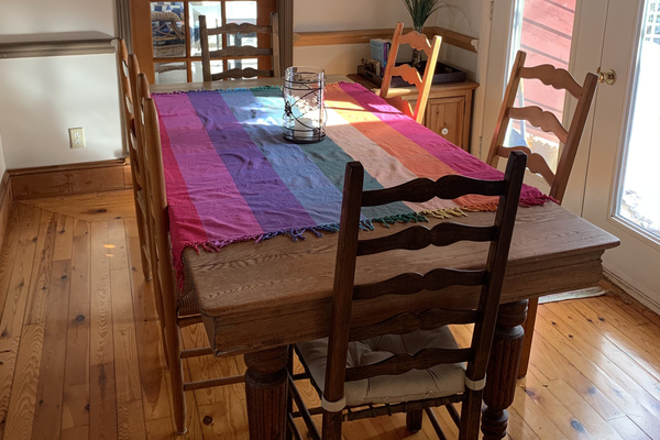 Dining table off kitchen area with seating for eight
