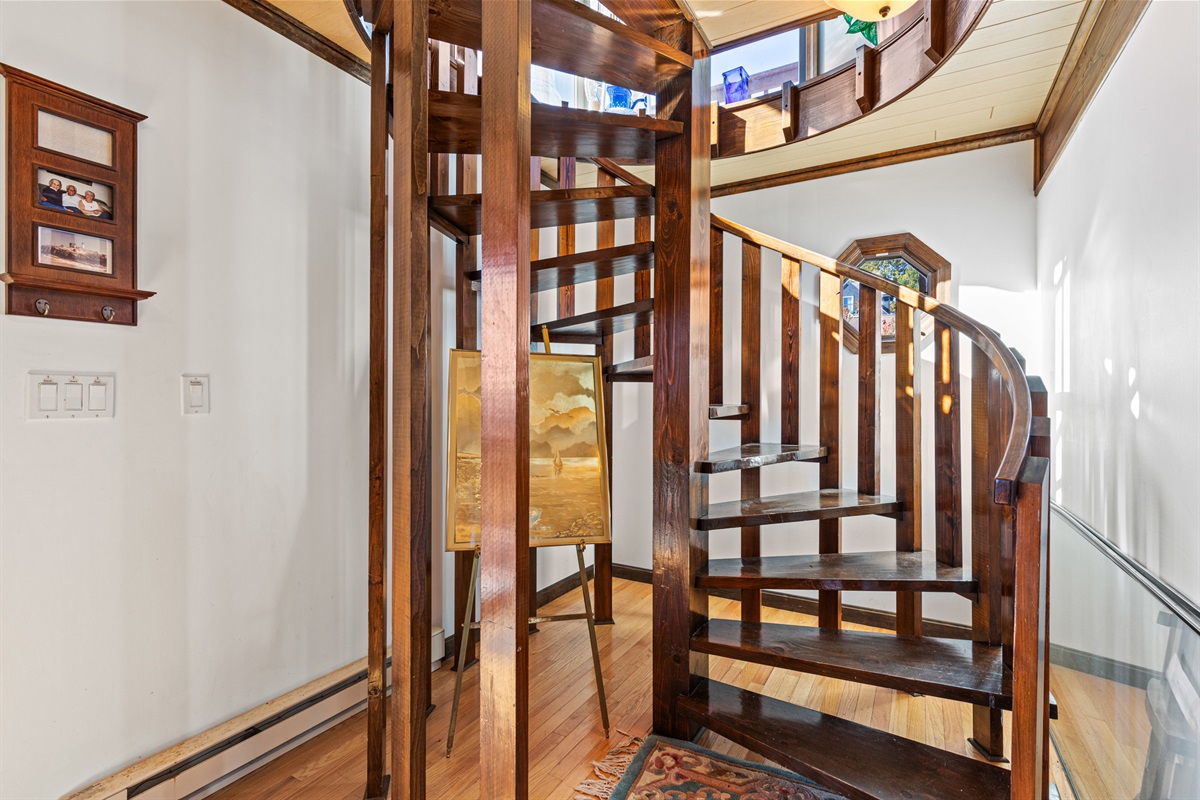 Spiral staircase to from bedrooms to living room