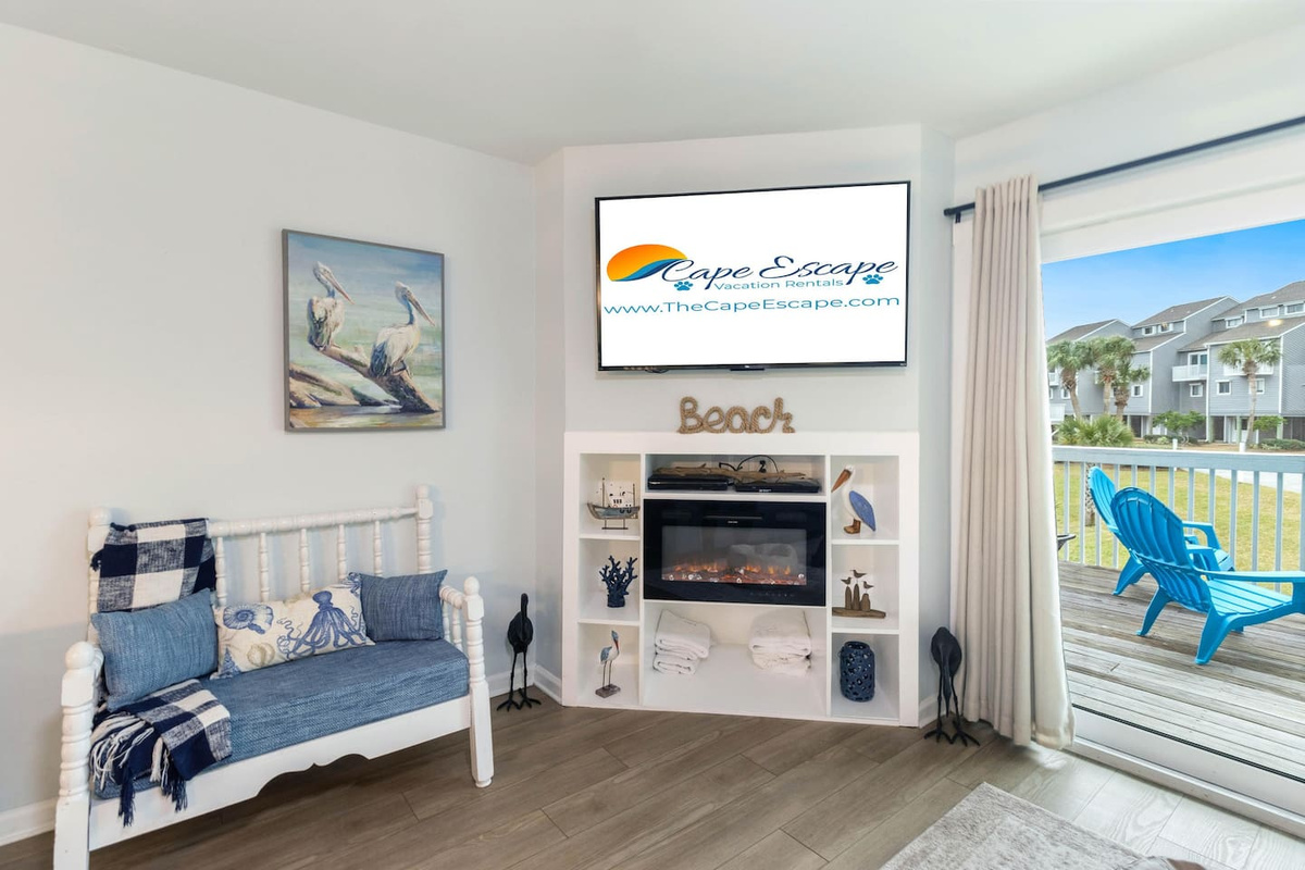 Settle in front of the electric fireplace on a cool evening &mdash; Smart TV ready, the whole group cozy.