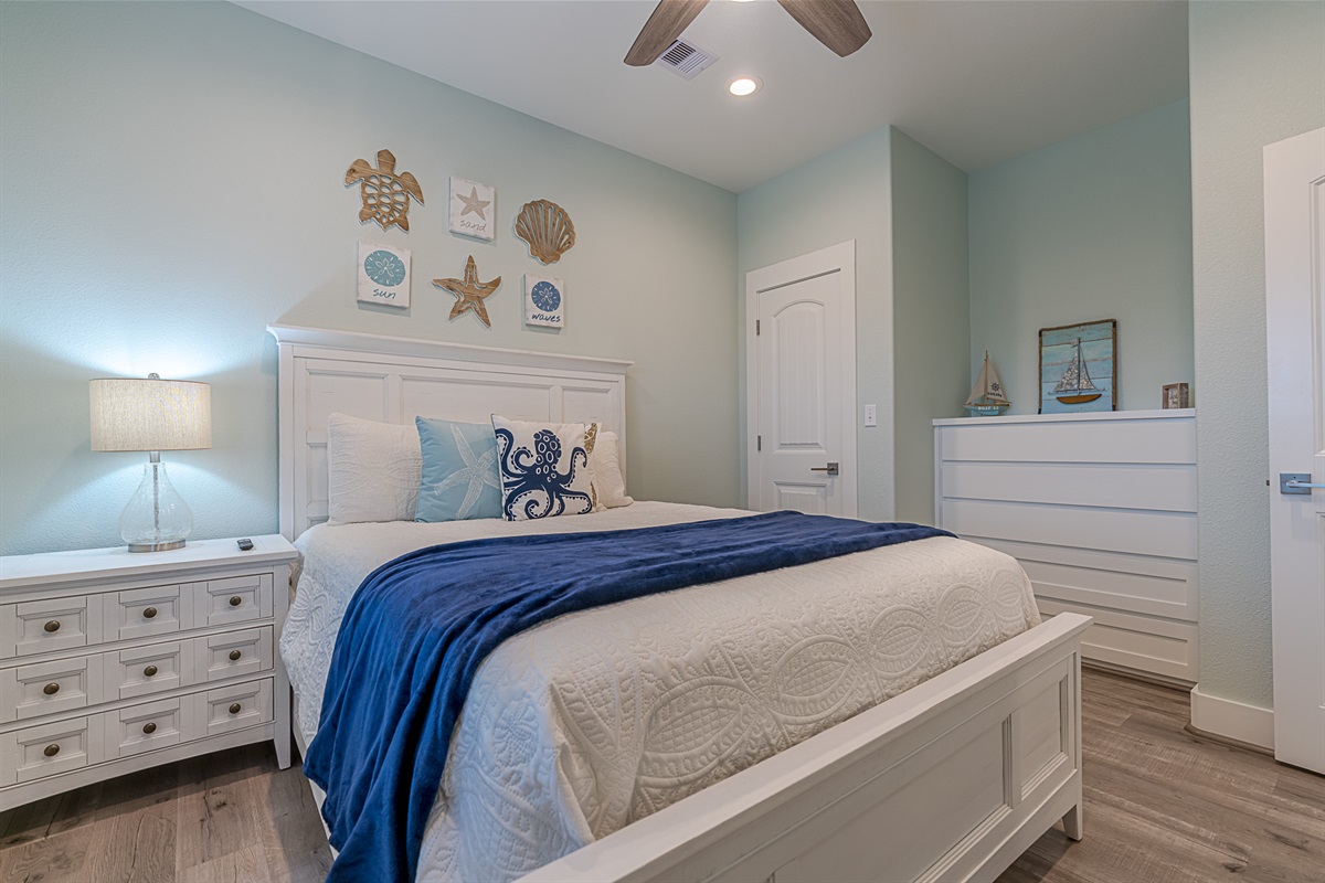 The second queen bed on the main floor.