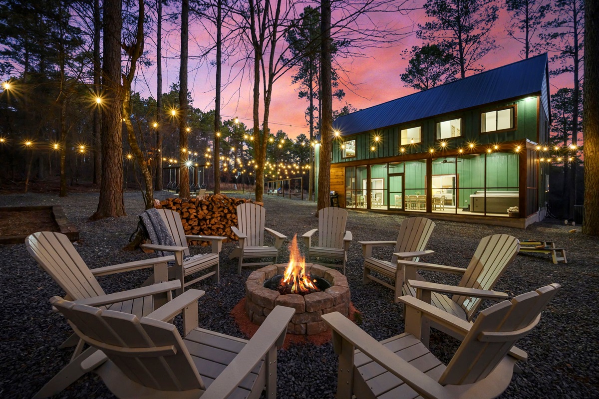 Firepit circle with caf&eacute; lights &mdash; s&rsquo;mores, stories, and late-night laughs 🔥✨