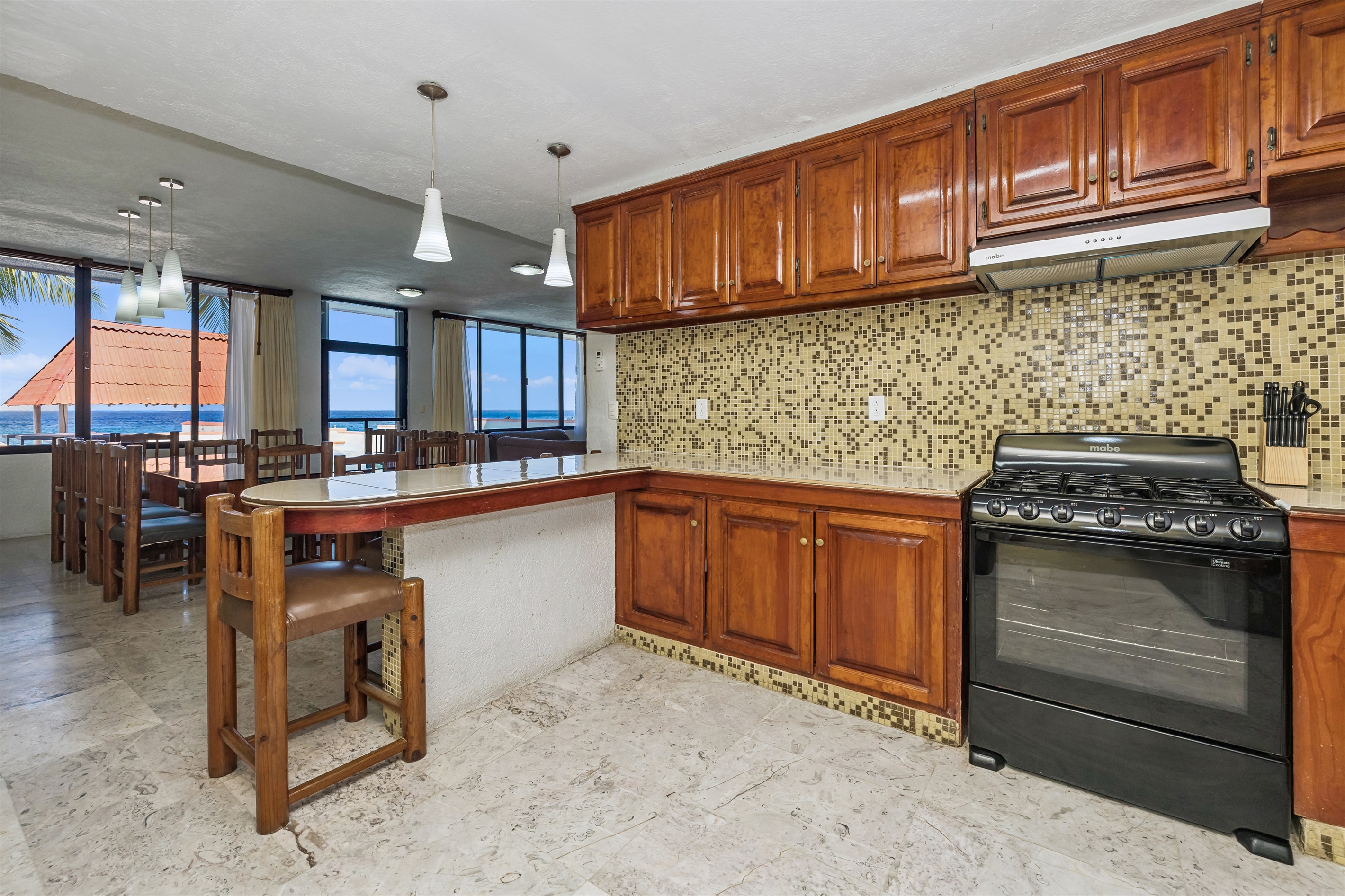 Kitchen Looking Out to Pool and Ocean