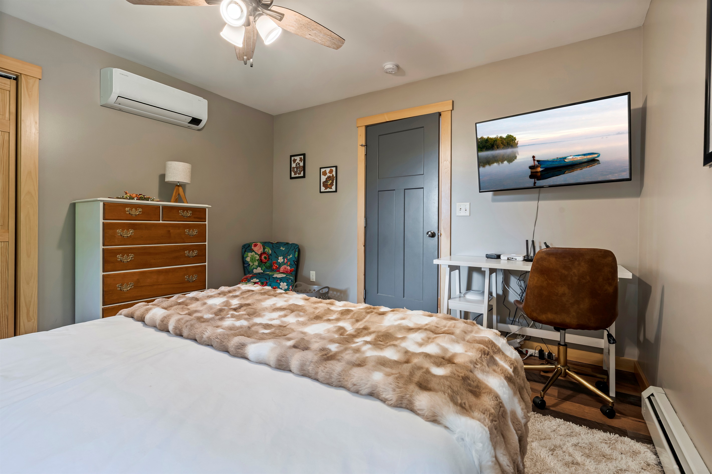 Easily accessible on the main floor, this bedroom includes a comfortable queen-size bed