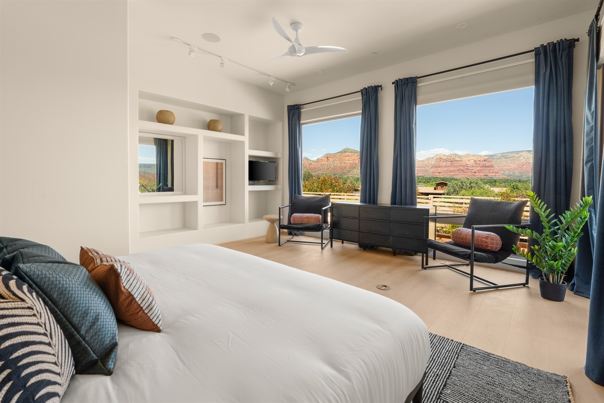 Wake up to unobstructed red rock views without leaving the covers. The primary suite offers massive picture windows, ample natural light, and premium linens.