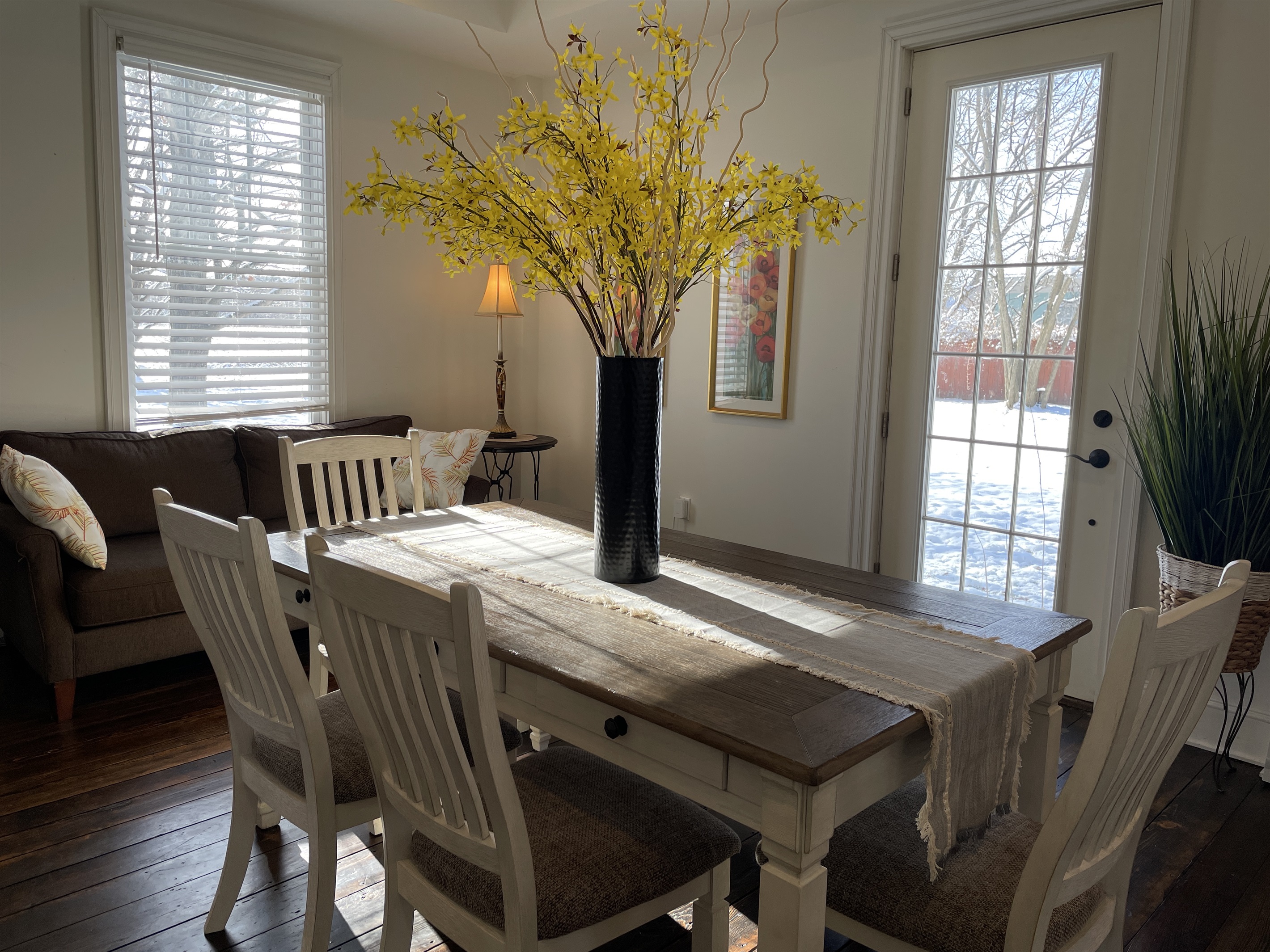 Dining area w/ door to side yard and fire pit.