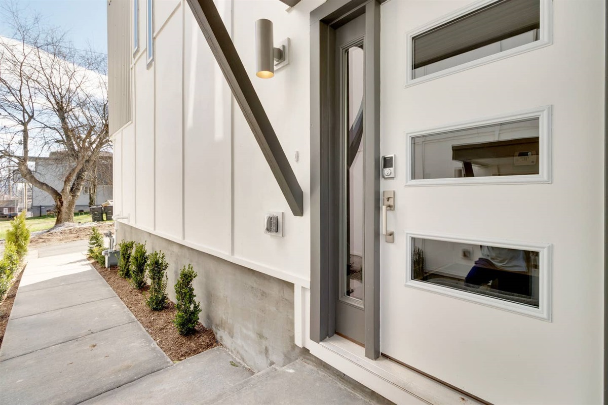 The front door has a keypad lock for 24/7 access by guests