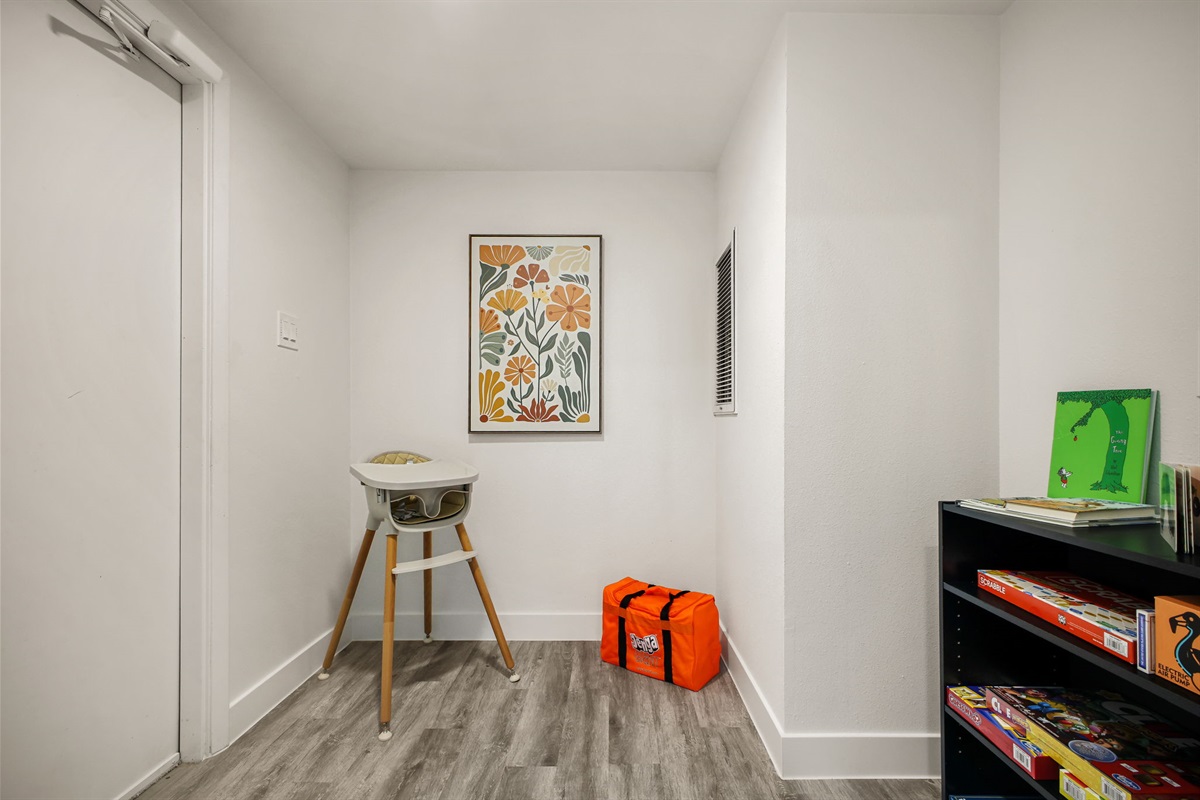 Tucked away in the downstairs hallway is a dedicated Children’s Play Area. A highchair and pack ’n play with sheets are provided, ensuring a comfortable and convenient stay for families with infants and toddlers.
