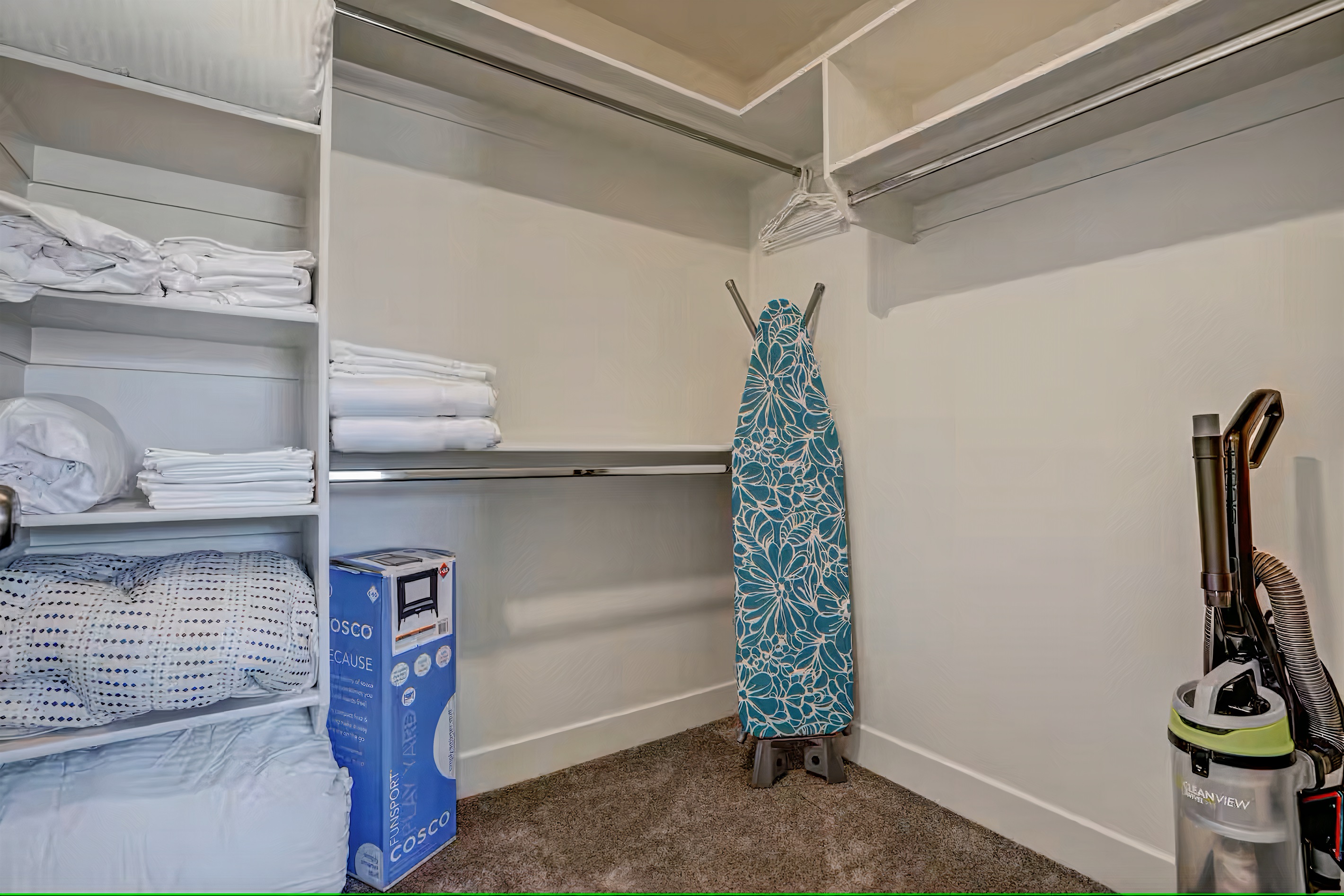 Portable crib, ironing board, Iron, extra linens, and towels.
