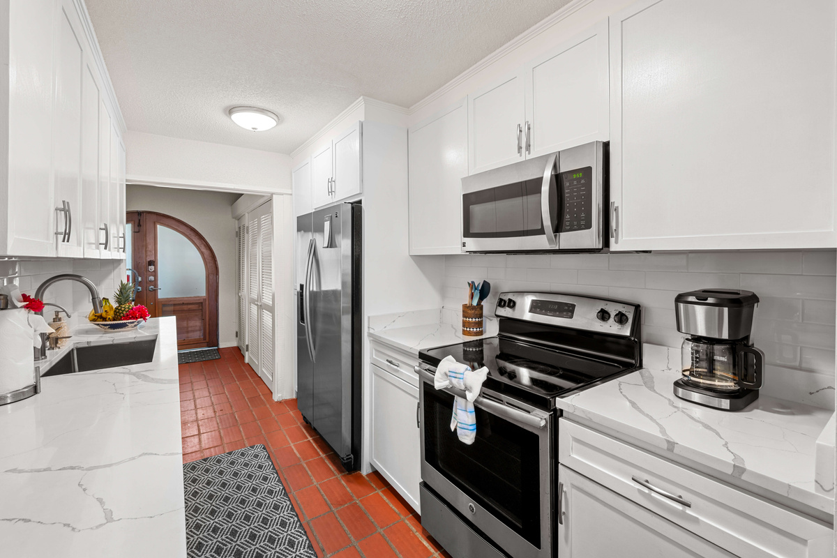Modern appliances, generous counter space, and an open layout make meal prep a breeze.