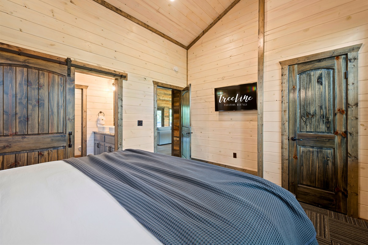 This luxurious bedroom boasts a spacious and airy feel, creating a tranquil haven for you to unwind in.