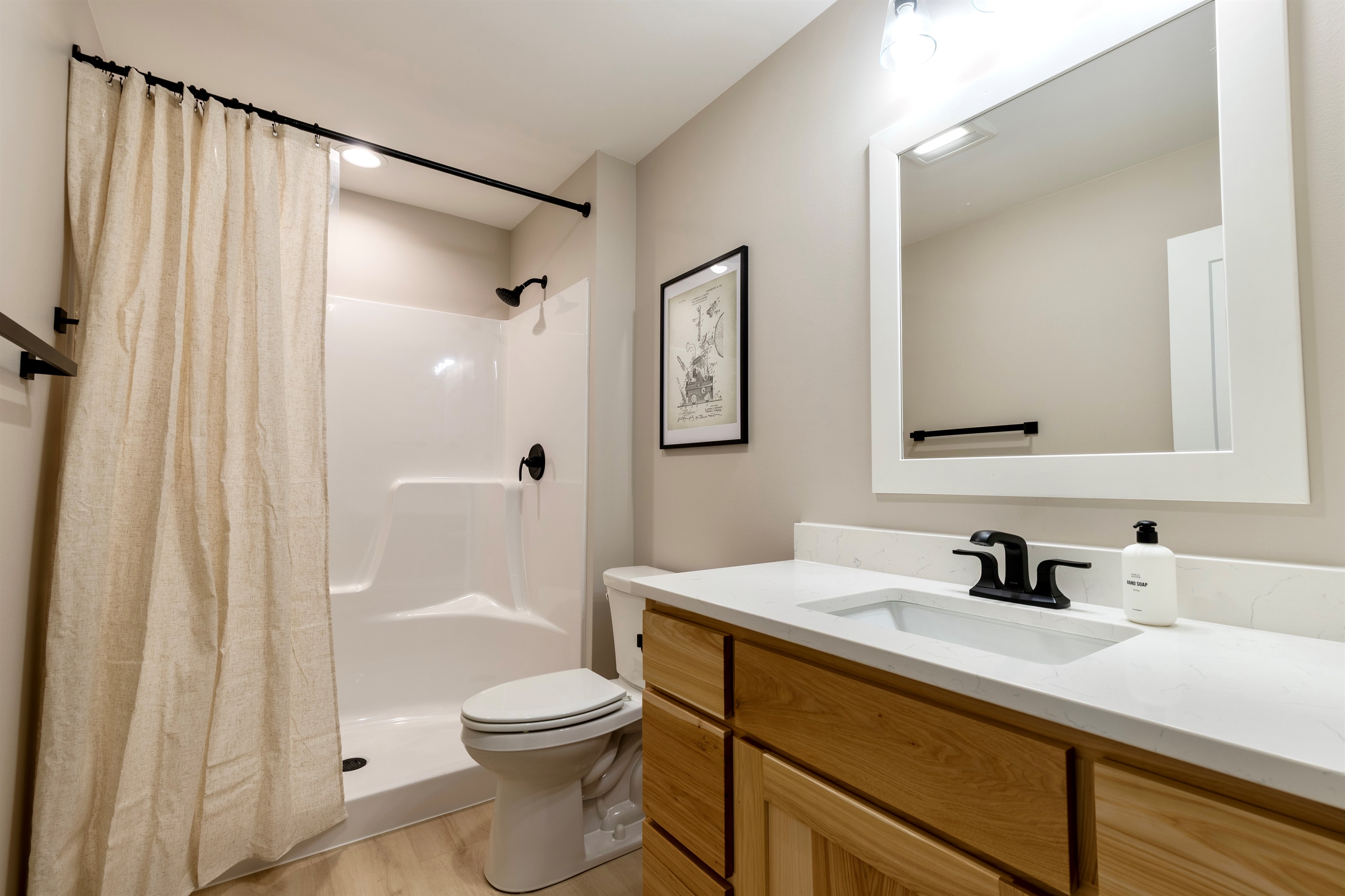 Upstairs bathroom. All our bathrooms come with shampoo, conditioner & body wash for our guests.