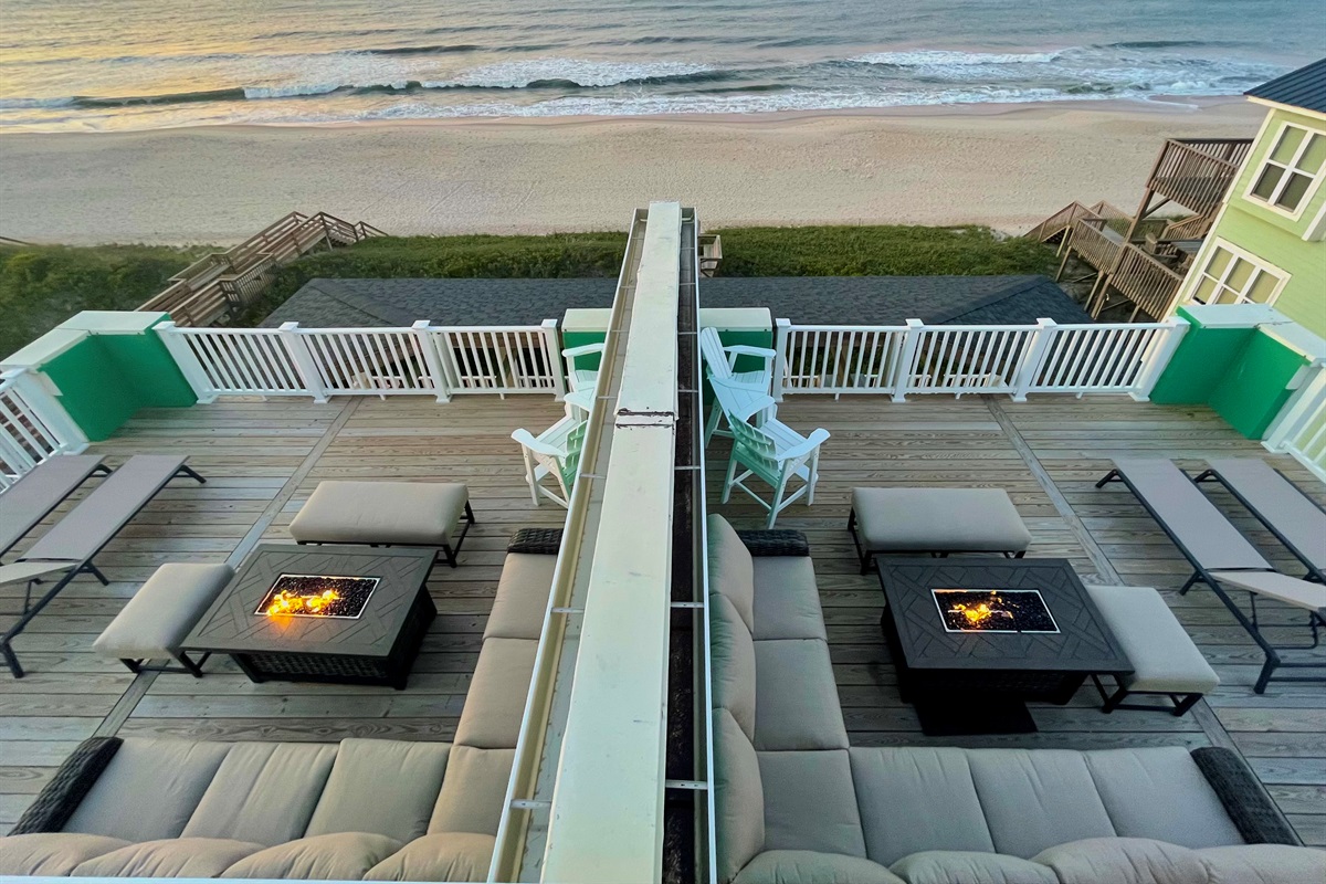 Cozy up by the fire pits on the rooftop decks ("Sun" left and "Stars" right)
