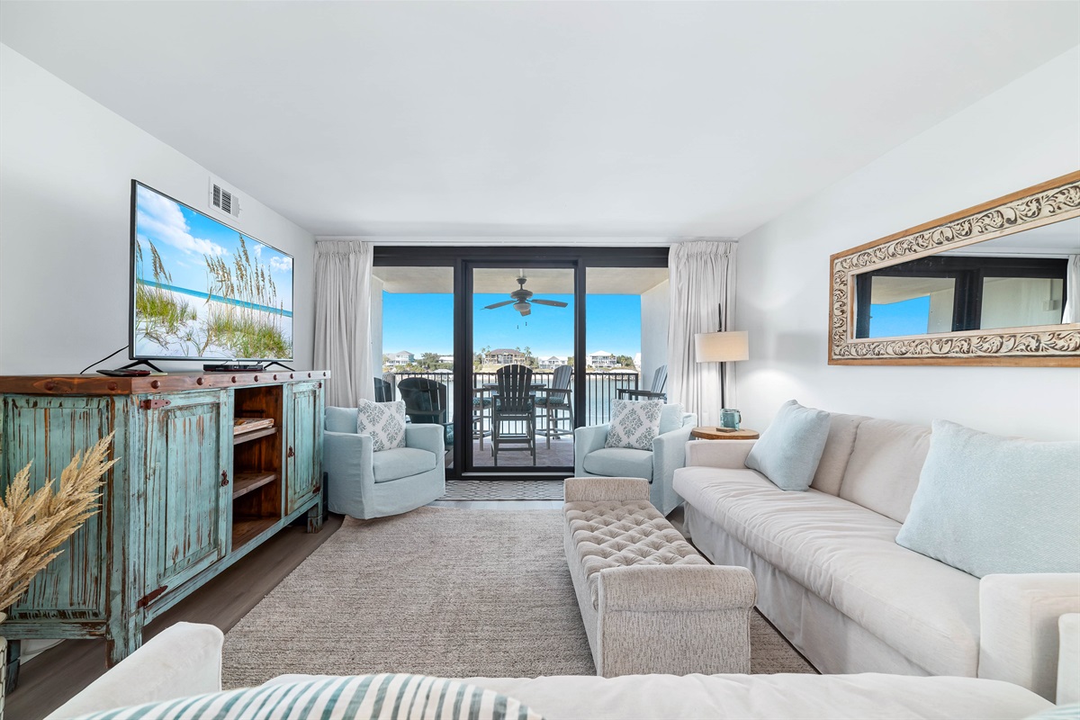 A light-filled living space with captivating views. This inviting room offers a perfect blend of comfort and style, creating a welcoming atmosphere for all.