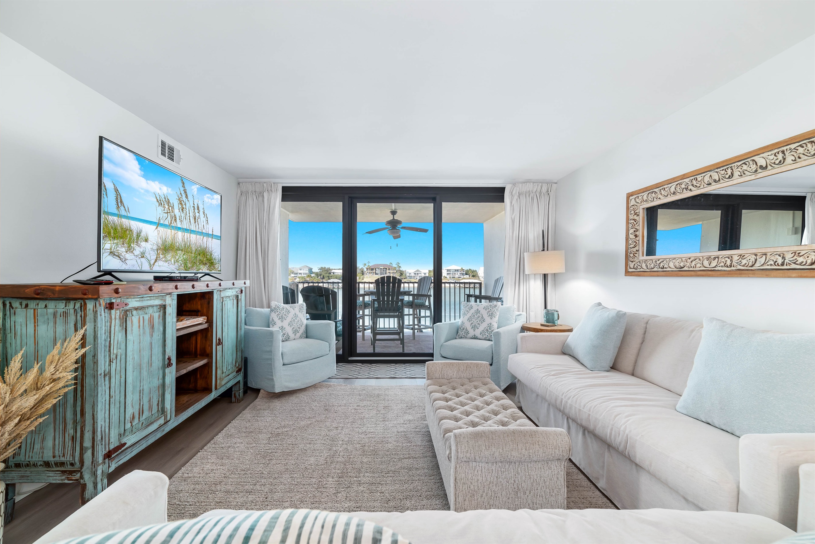 A light-filled living space with captivating views. This inviting room offers a perfect blend of comfort and style, creating a welcoming atmosphere for all.