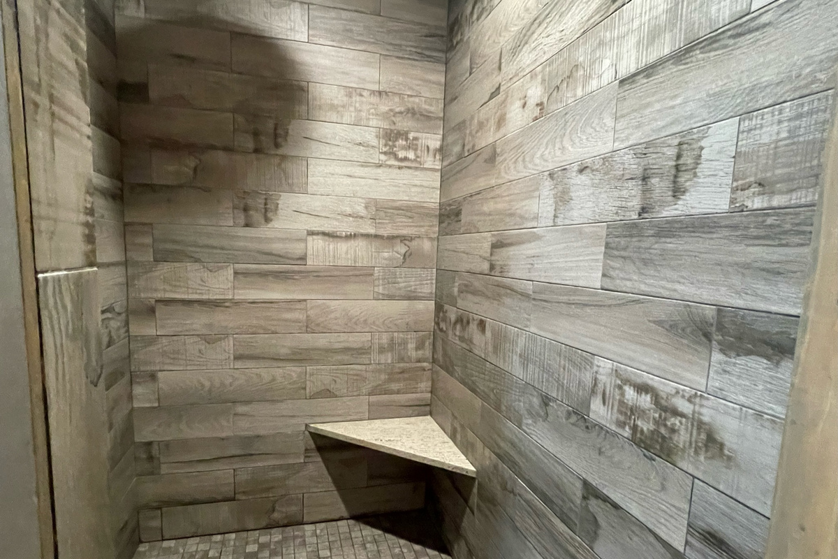 Downstairs Master bath with a luxurious tile finish