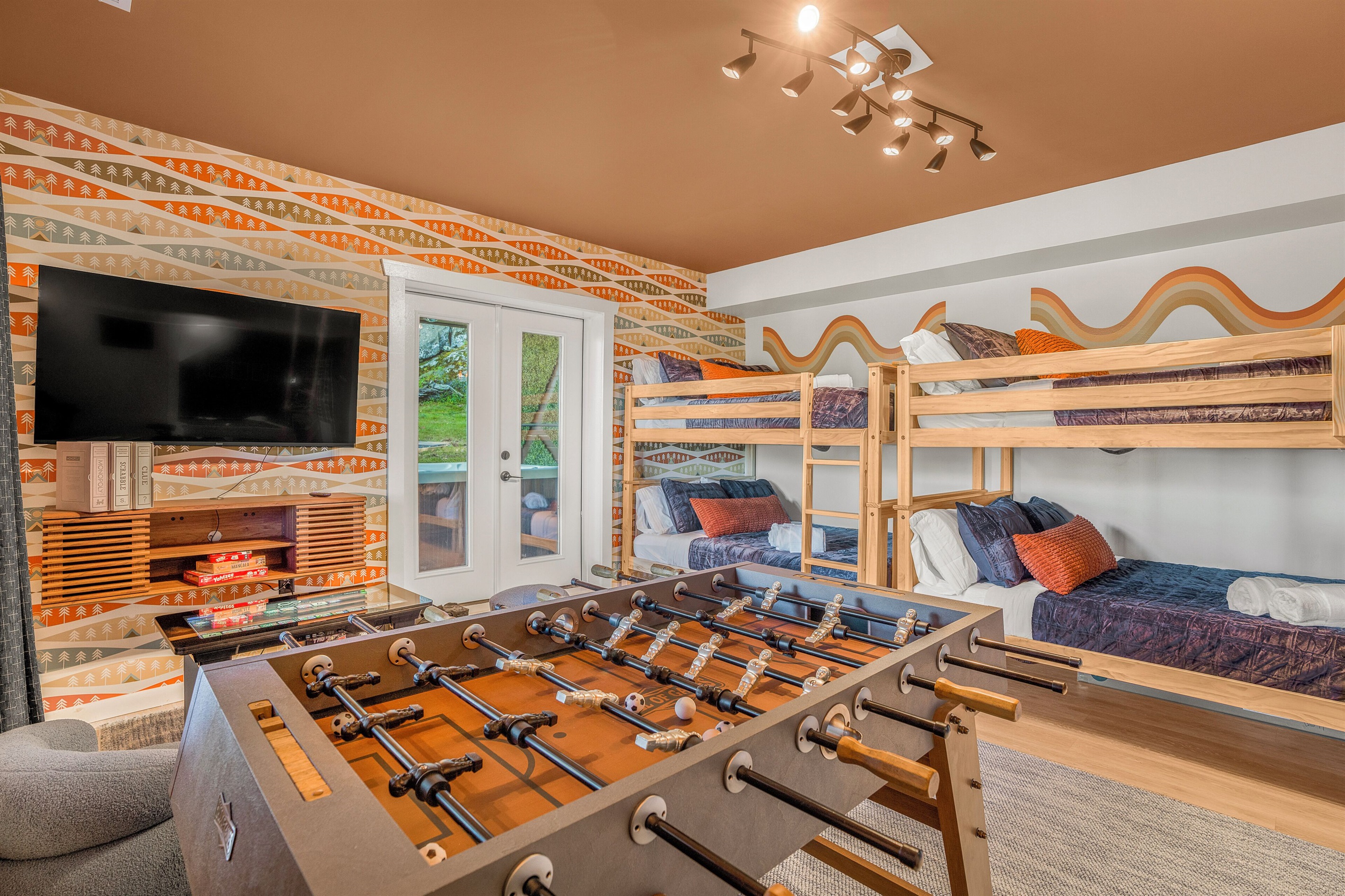 BR5: Two sets of queen-over-queen bunk beds, plus foosball, infinity game table