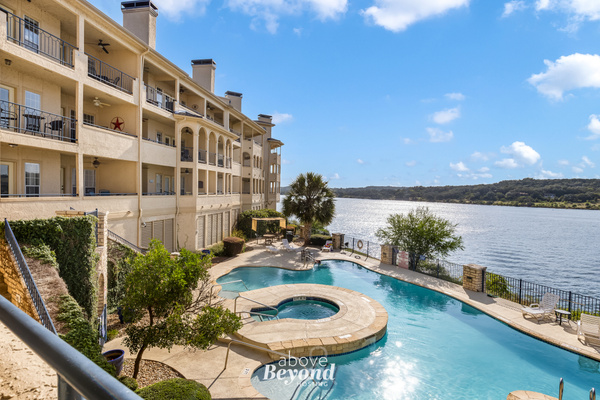 Resort-style waterfront pool and hot tub overlooking Lake Travis at The Island.