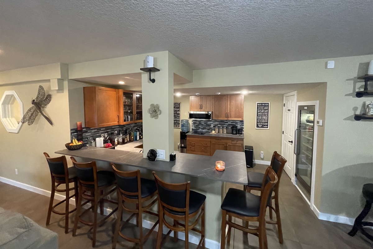 Kitchen & wet bar, and seating for 6.