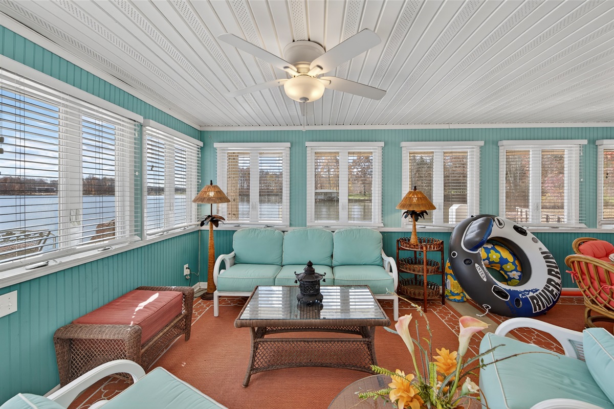 Sun-filled lounge with panoramic lake views—an ideal spot to relax between lake adventures.