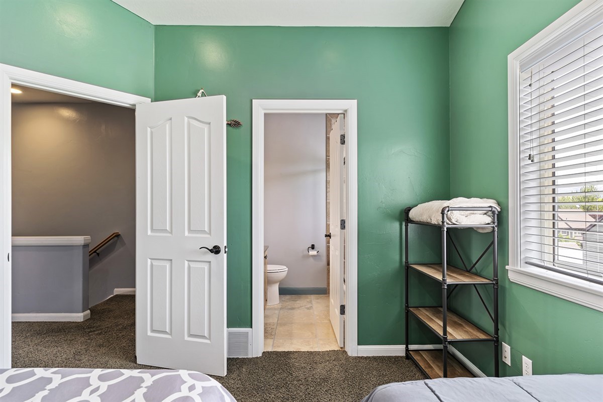 A thoughtfully designed twin suite with ensuite access, offering privacy, comfort, and convenience for family or guests.