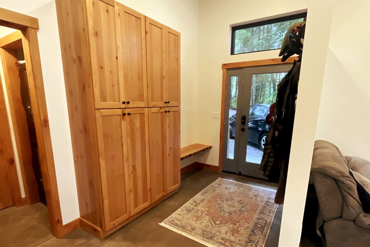Entryway with seating and hooks for all your outdoor gear.