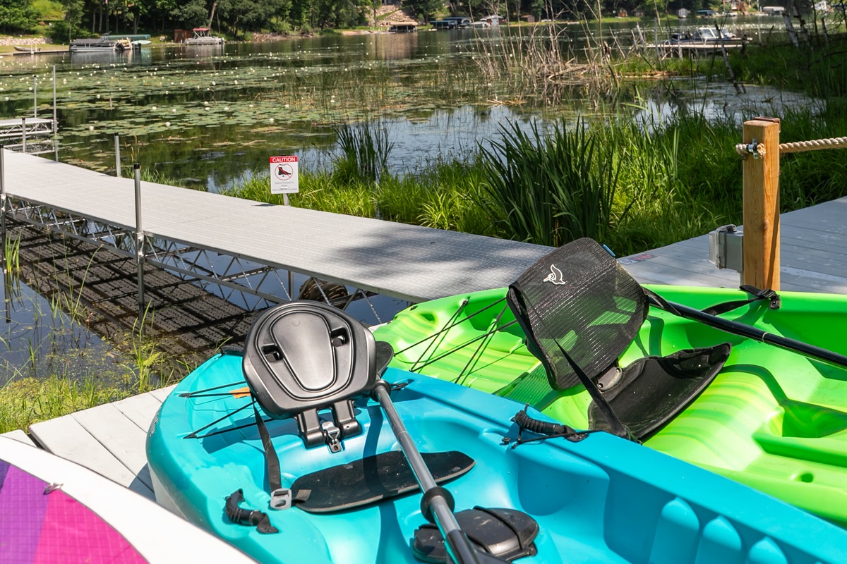 Kayaks and paddleboards are ready and waiting by the water—just grab one and glide across the lake!