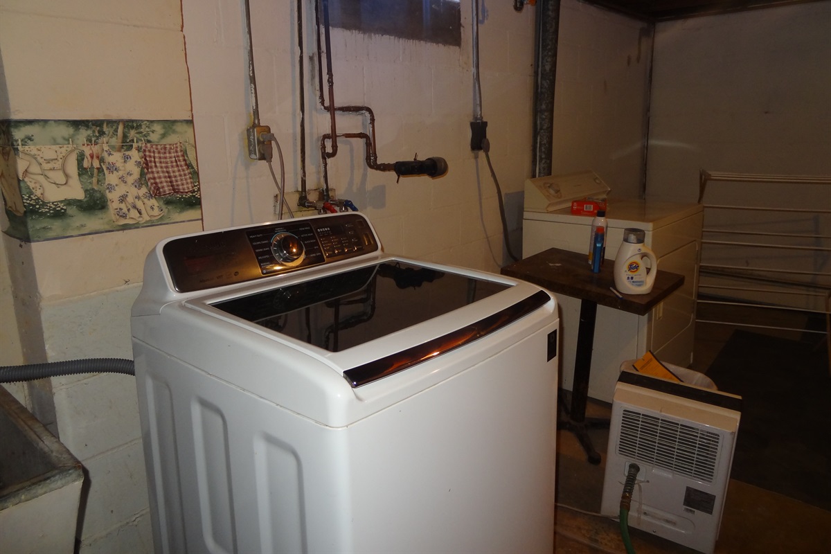 Full size washer and dryer, iron, drying rack and other related extras