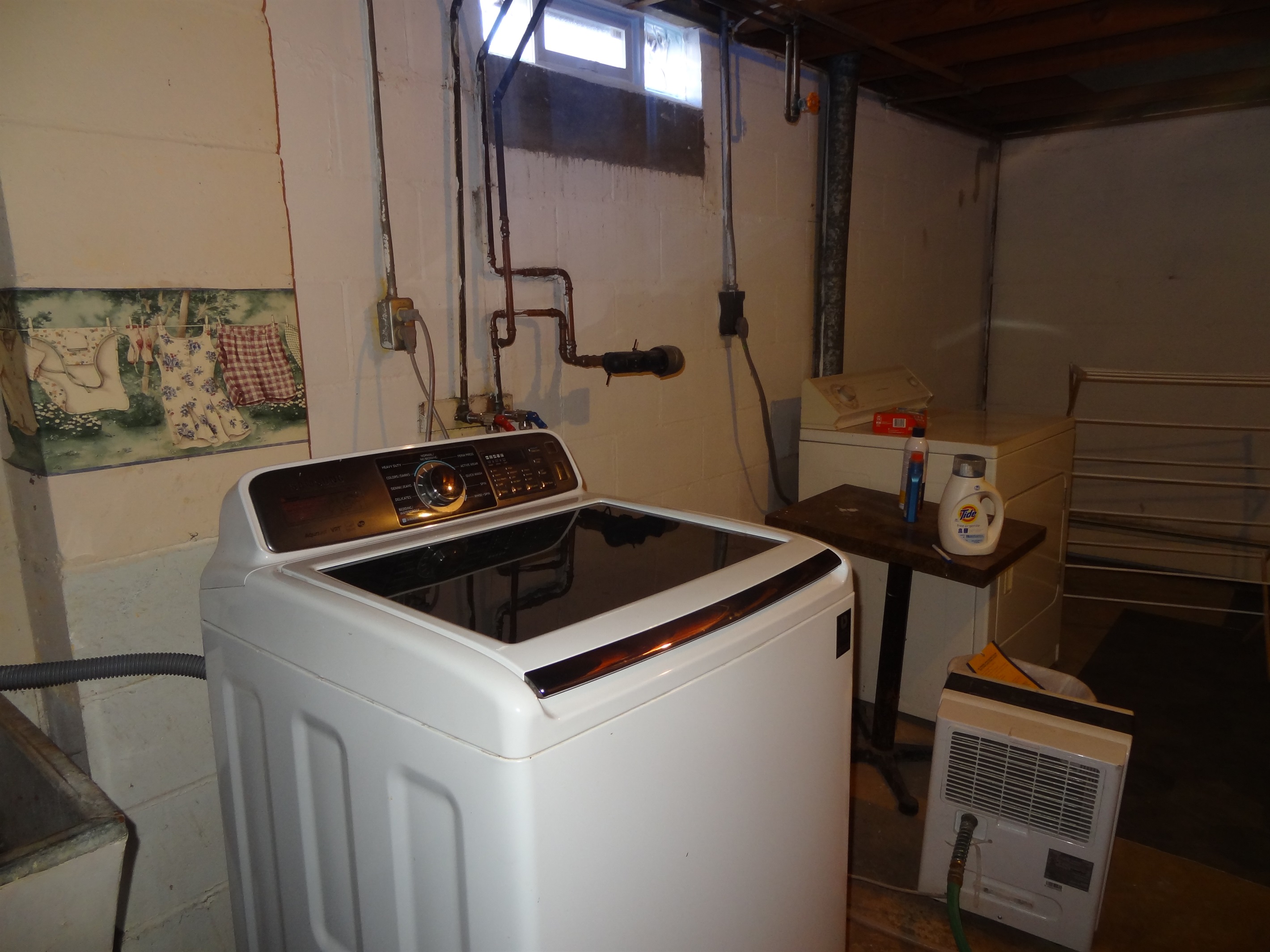 Full size washer and dryer, iron, drying rack and other related extras