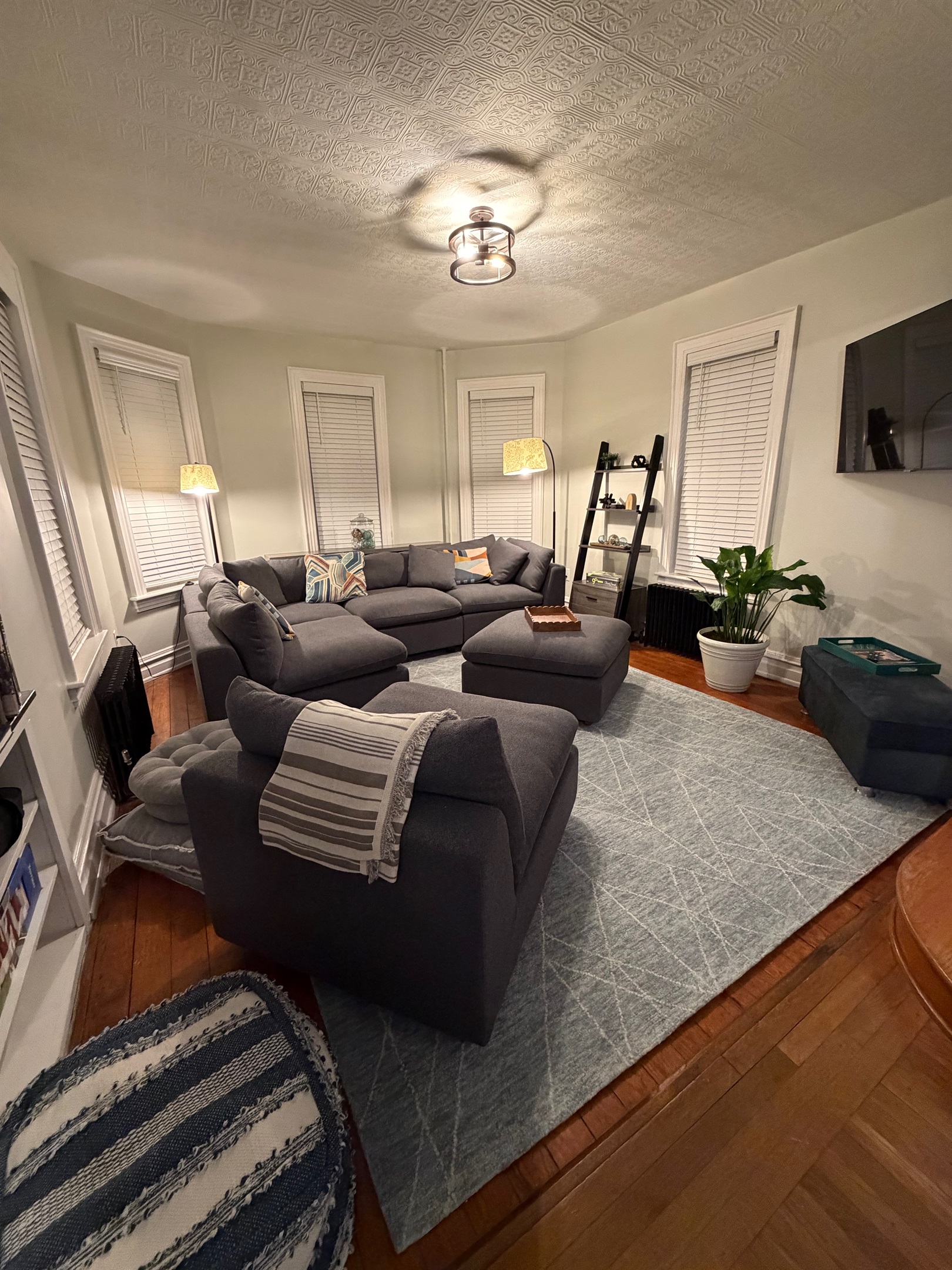 Spacious living room with large sectional seating smart TV and open layout