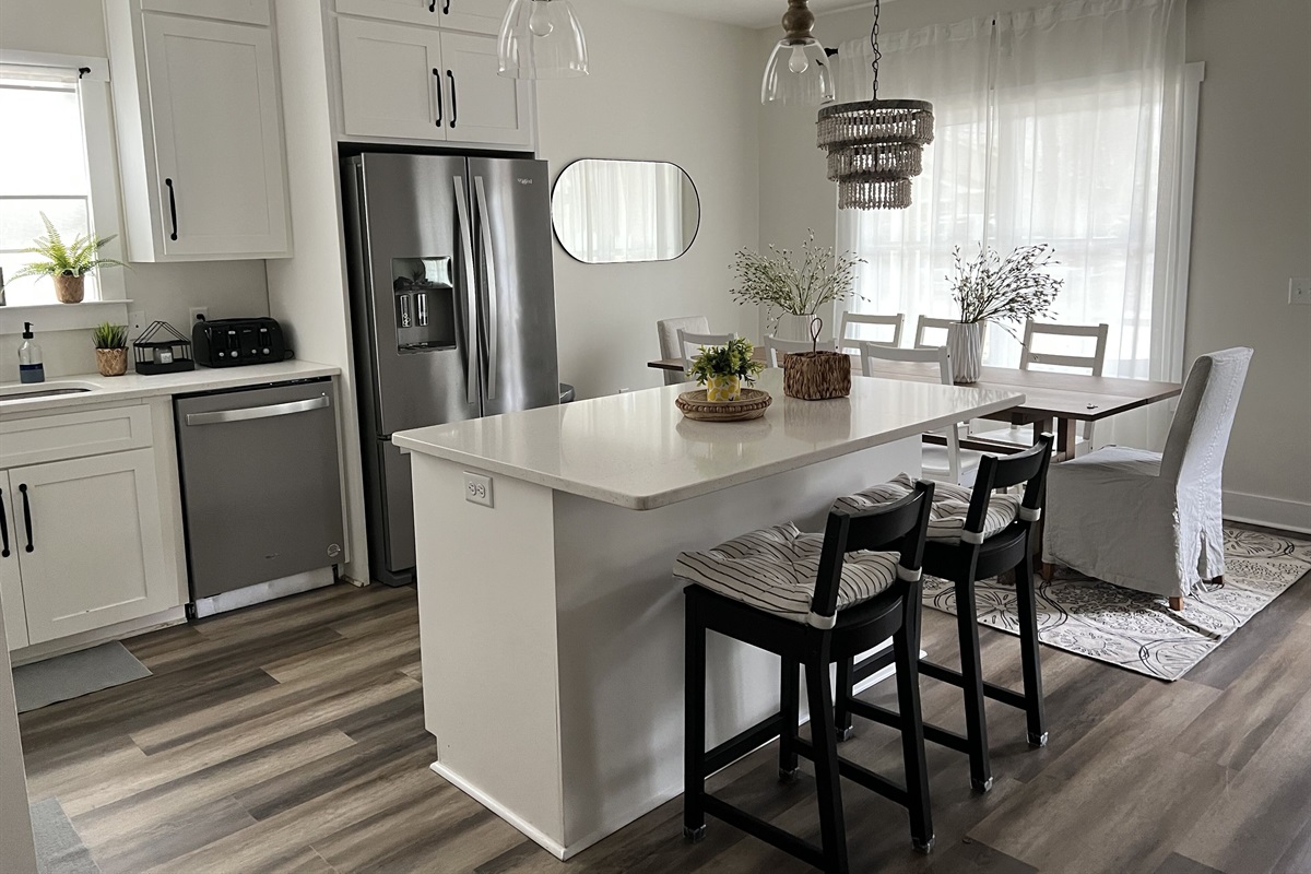 The well-equipped kitchen has a nice size island with 2 stools.