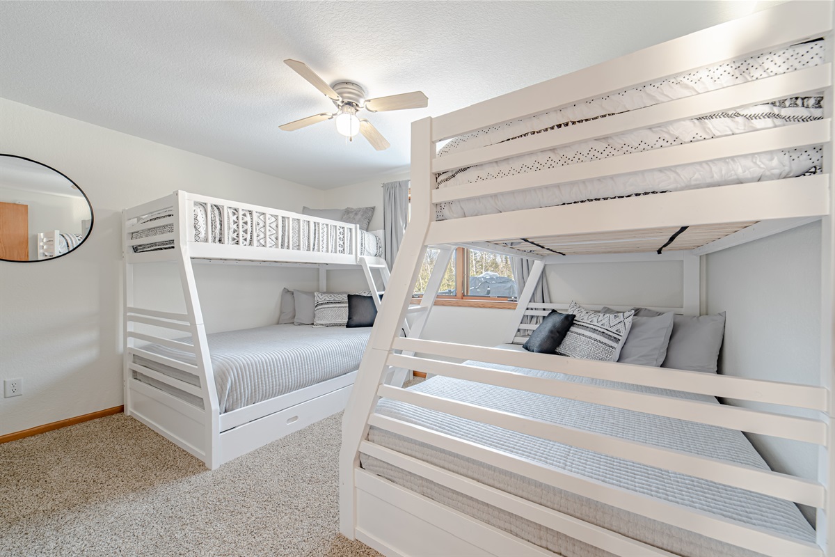Main level bunk room is a blast for sleepovers. Offer a full size bottom bed and twin size mattress on top.