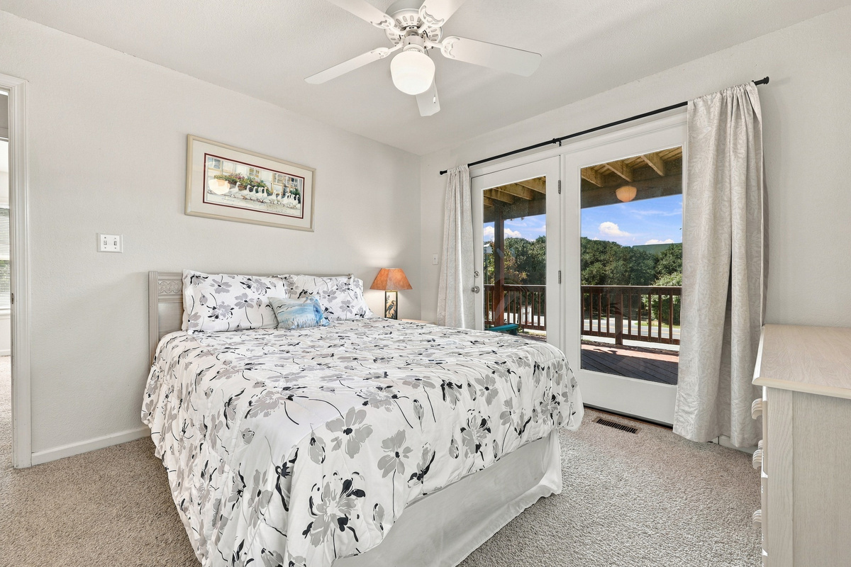 Fresh, breezy and bright, with French doors opening to the covered deck.