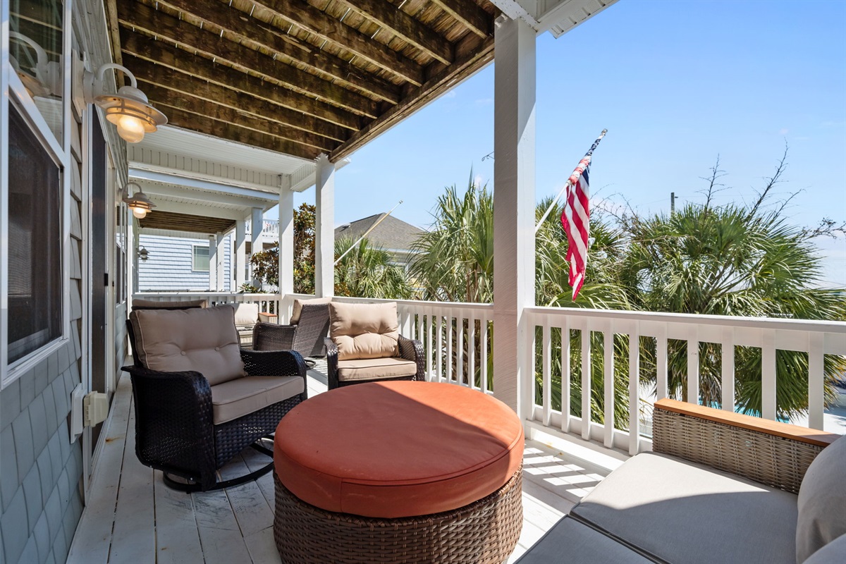 Embrace the charm of outdoor living with this cozy porch setup