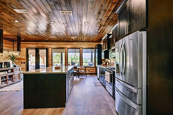 Cook, laugh, and share stories in this chef-style kitchen with premium appliances and open-concept design